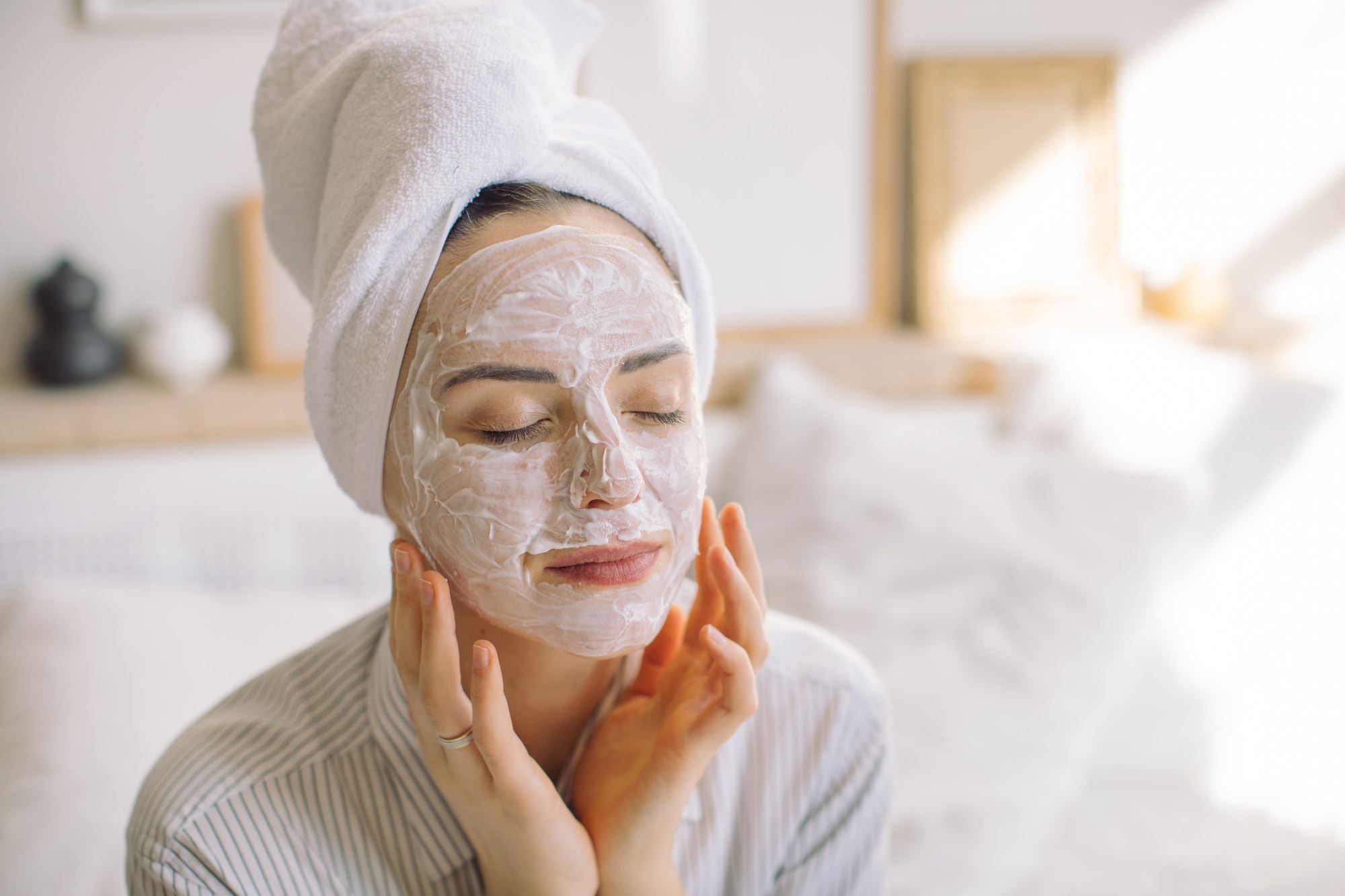 young-woman-making-face-mask-in-the-morning-at-home-